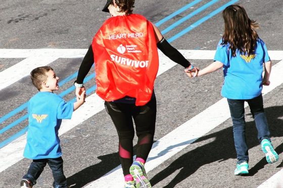 Lauren Pino crossing Boston Marathon Finish Line with her kids