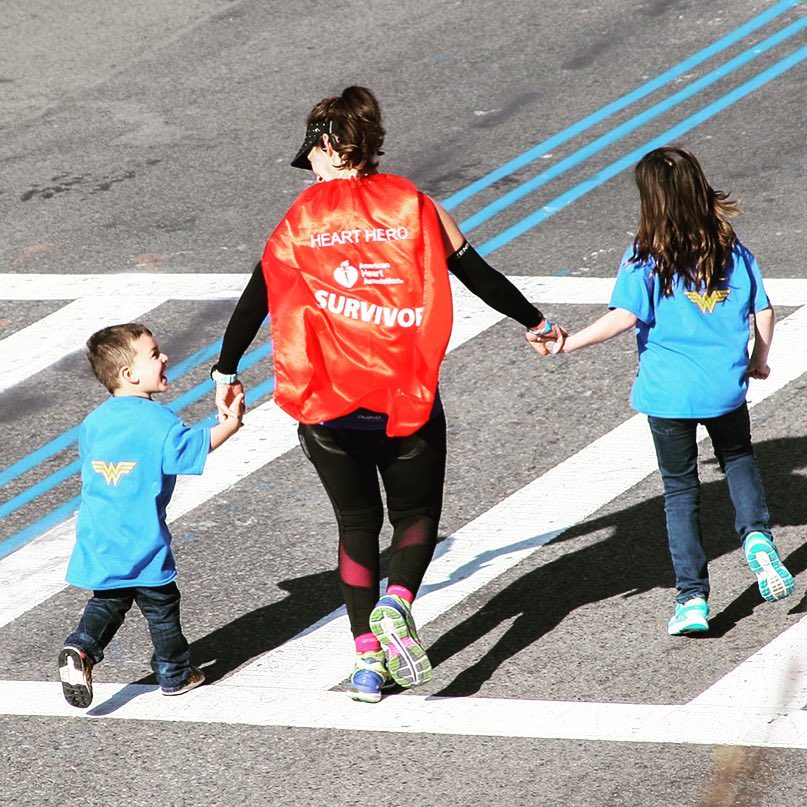 Lauren Pino crossing Boston Marathon Finish Line with her kids