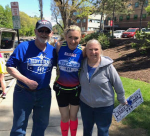 Bridget with her parents on a run through Boston