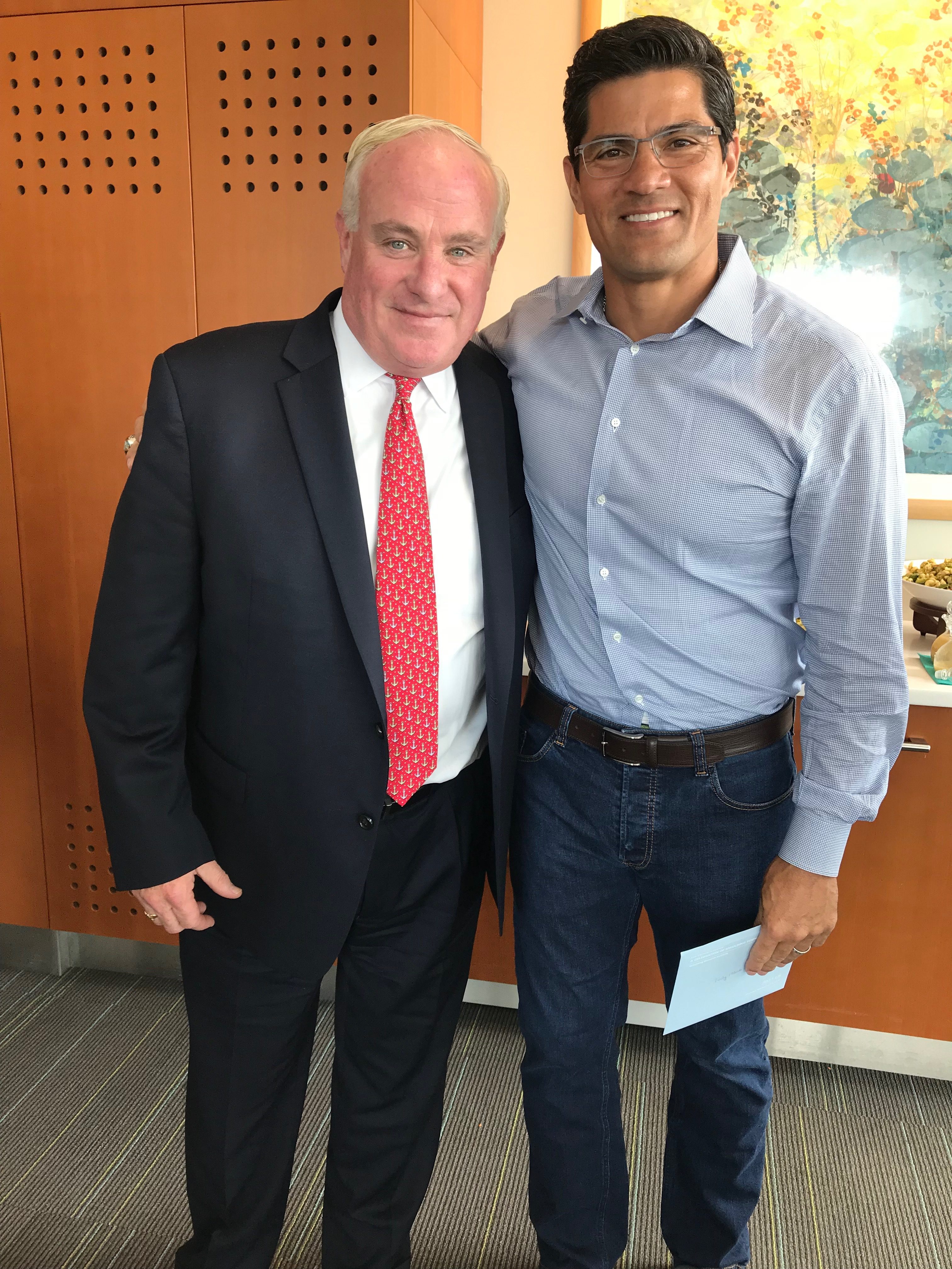 Tedy Bruschi & Richard Walsh pose for a photo